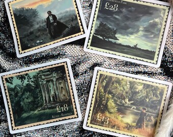 May include: Four square stickers with postage stamp designs. Each features a different landscape painting with a person or building. The stamps have a cream border and the price in British pounds. The background is a black and white patterned fabric.