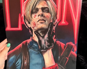 May include: A painting featuring a person with blood splatters, wearing a blue top and black gloves, with the name "LEON" in red neon-style letters. The artwork has a dark backdrop and a signature in the bottom right corner.