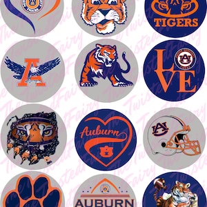 May include: Nine round stickers featuring various Auburn University logos and designs. The stickers include a tiger, a football helmet, a paw print, a heart, and the words "Auburn Tigers".
