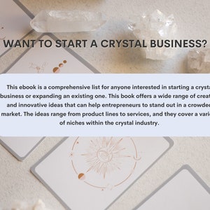 May include: A light blue and white text box with the text "WANT TO START A CRYSTAL BUSINESS?" in black text. The text box is on top of a white background with a crystal and a card with a sun and moon design.