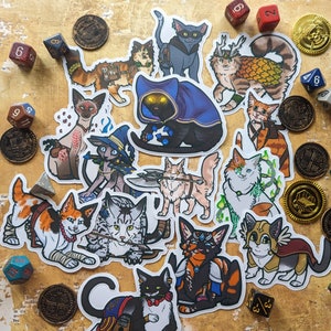 May include: A collection of 15 colorful cat stickers with various poses and designs. The stickers feature cats in different outfits, including a wizard hat, a cloak, and a crown. Some cats are holding swords, axes, and other weapons. The stickers are perfect for adding a touch of whimsy to any surface.