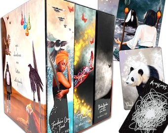 May include: A set of three boxed tarot and oracle decks. The decks are titled "Familiars Way Tarot", "Familiars Way Oracle", and "Shadow Garden Oracle". The boxes are decorated with colorful illustrations of animals, plants, and other mystical imagery.