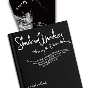 May include: A black book with the title "Shadow Worker embracing the Divine darkness" in white script. The book is a guided workbook for exploring your shadow from a relational healing perspective through the tarot.
