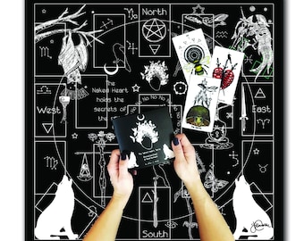 May include: A black and white tarot cloth with a pentagram in the center, surrounded by astrological symbols and illustrations. The cloth is laid out on a table with a small black book and four tarot cards on top of it.