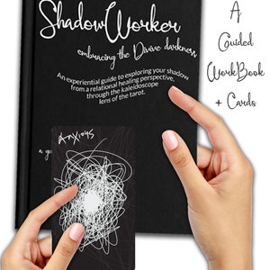 May include: A black book with the title "Shadow Worker embracing the Divine darkness" and the text "An experiential guide to exploring your shadow from a relational healing perspective, through the kaleidoscope lens of the tarot."  A black card with white scribbles and the word "Anxious" is shown in the image.