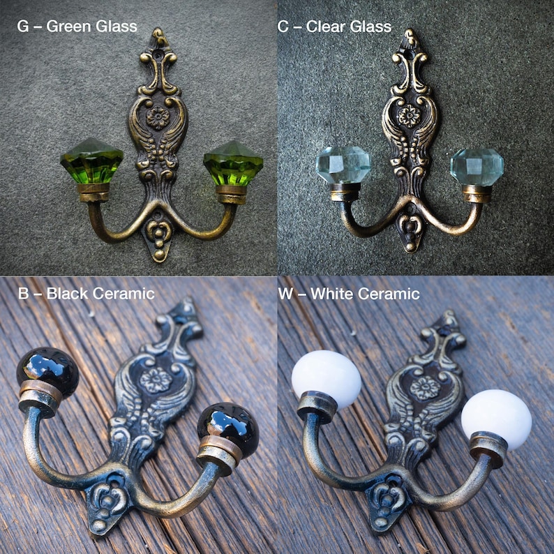 May include: Decorative wall hooks with ornate metalwork and various knob options. The image shows hooks with green glass, clear glass, black ceramic, and white ceramic knobs. Each hook has two knobs and a decorative backplate.