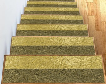 May include: A set of 10 non-slip stair treads with a textured, woven design in shades of brown and beige. The treads are designed to add safety and style to stairs.