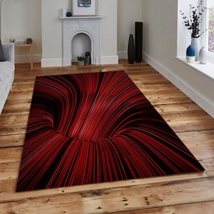 Puede incluir: Alfombra de área abstracta con fondo negro y líneas rojas que crean un patrón de remolino en forma de vórtice.