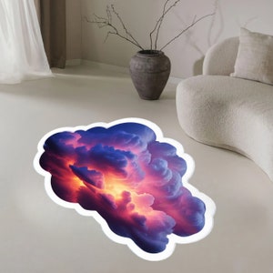 Può includere: Un adesivo per pavimenti che presenta una formazione di nuvole astratta e colorata con sfumature di viola, blu e arancione. La nuvola sembra fluttuare sopra il pavimento, creando un effetto 3D.