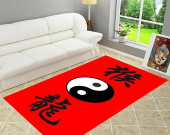 May include: Red rug featuring a black and white yin yang symbol and Chinese characters. The characters are "禅" and "龍", which translate to "Zen" and "Dragon".