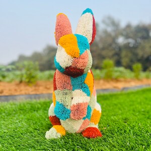 Animal Topiary Colourful Rabbit Both Hands Up is made of  fibreglass and artificial turf for home, garden, and outdoor