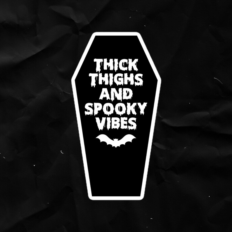 May include: Black and white coffin-shaped sticker with the text "THICK THIGHS AND SPOOKY VIBES" and a bat silhouette.