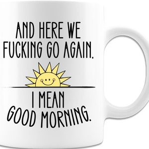Puede incluir: Taza de caf&eacute; blanca con texto negro que dice "And here we fucking go again. I mean good morning." Un sol amarillo con una cara sonriente est&aacute; sobre el texto.