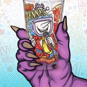May include: A clear glass with a cartoon illustration of a TV-headed character holding a microphone. The character is wearing a red suit and yellow tie. The glass is held by a purple hand with long claws. Text on the glass reads "Mr. Antenna" and "Famous Mystery Board".