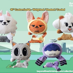 May include: Five 16-inch customizable weighted, heated, or cooled plush toys featuring various animal characters including a white dog, orange fox, white bear, gray cat, and purple creature, each with a distinct head and body design.