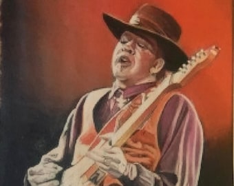 Musician Stevie Ray Vaughan playing his guitar