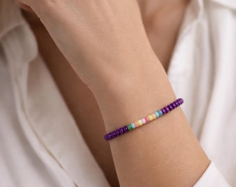 Handmade Purple Beaded Bracelet: Pastel Accents, Gold Detail