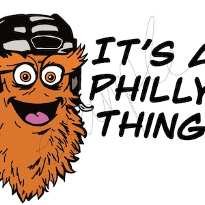 Puede incluir: Una criatura peluda naranja de dibujos animados con un casco de hockey negro y gafas. La criatura tiene una gran sonrisa y dice "It's a Philly Thing".
