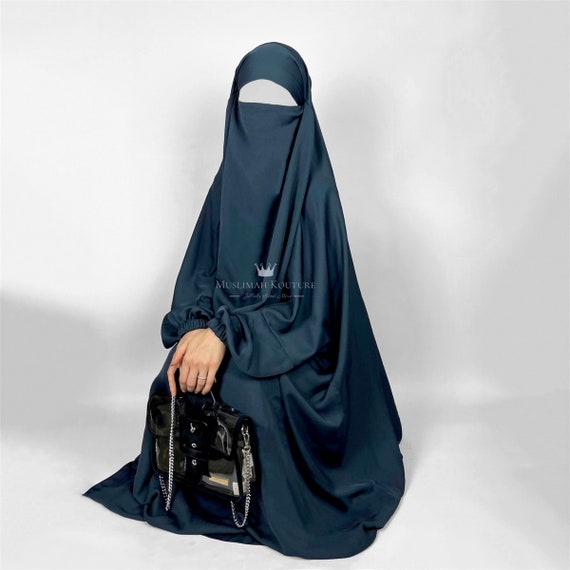 Elderly Muslim Arab Woman in Black Nikab and Abaya with a Handbag