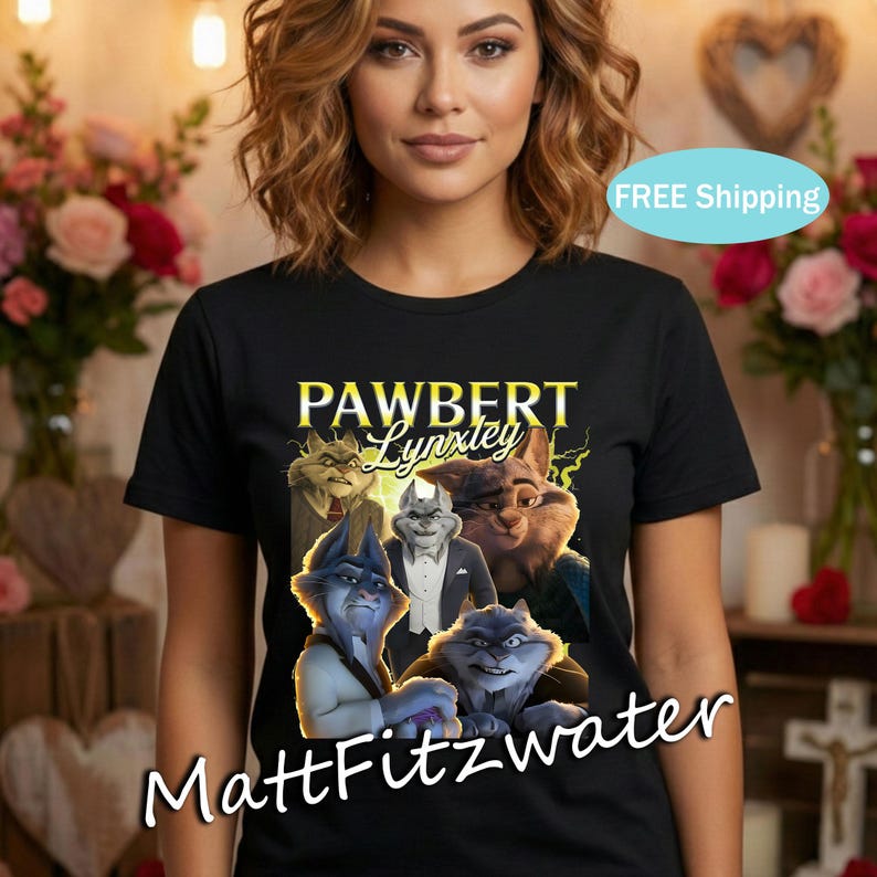 以下が含まれることがあります： 黒いTシャツ。擬人化された猫のグラフィックと「PAWBERT Lynxley」の文字が特徴です。デザインは、さまざまなポーズと色で描かれた複数の猫のキャラクターを示しています。アーティスト名「MattFitzwater」が下部に印刷されています。