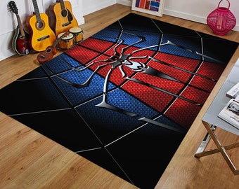 May include: A black, red, and blue area rug with a large, silver spider web design. The spider web has a black spider in the center.
