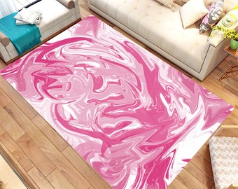 Op de afbeelding: Roze en witte abstracte vloerkleed met een draaiend marmerpatroon. Het kleed heeft een modern en eigentijds ontwerp.
