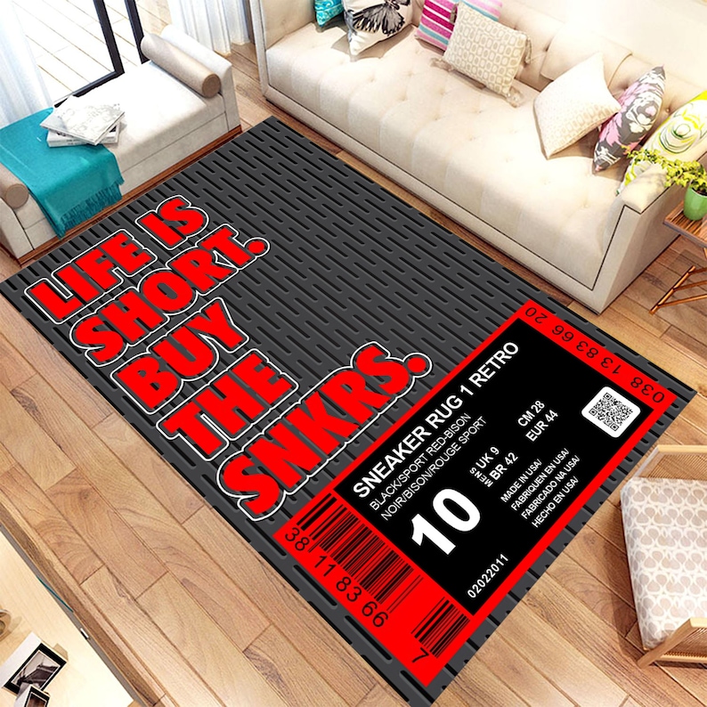 May include: A black and red rug with the text "Life is short. Buy the sneakers." and a barcode with the text "Sneaker Rug 1 Retro" and "10".