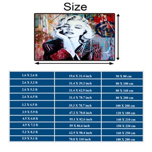 May include: A chart showing different sizes of a print with measurements in feet, inches, and centimeters. The print features a colorful abstract portrait of a woman with a red and white patterned shirt.