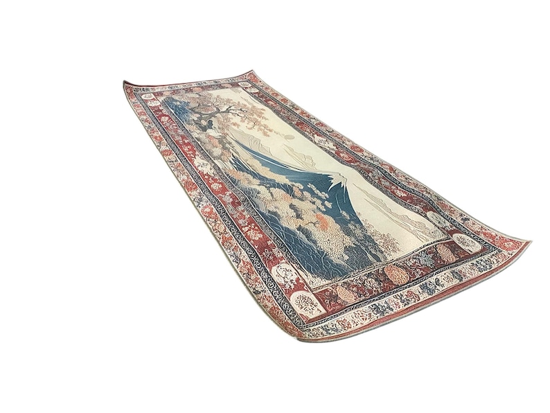 May include: A long, rectangular rug with a detailed, colorful border and a central image of a mountain scene. The mountain is blue and white, with a white peak and a white background. The border is red, blue, and white, with intricate floral and geometric patterns.