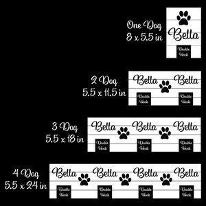 May include: A set of four white wooden wall-mounted hook racks with black text and paw print graphics. The signs feature the name Bella and the label Double Hook, with dimensions listed as 8x5.5 inches, 5.5x11.5 inches, 5.5x18 inches, and 5.5x24 inches.
