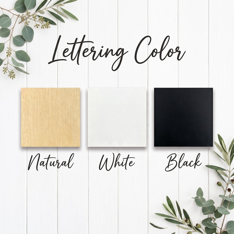 以下が含まれることがあります： Lettering Colorというタイトルのカラーチャートには、Natural、White、Blackとラベル付けされた3つの正方形のサンプルが表示されています。Naturalは明るい木目調、Whiteは無地の白、Blackは無地の黒い正方形です。