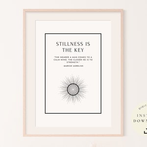 May include: A printable quote about stillness being the key to strength, with a black and white sunburst design. The quote is attributed to Marcus Aurelius. The text reads "Stillness is the key. "The nearer a man comes to a calm mind, the closer he is to strength." -Marcus Aurelius"