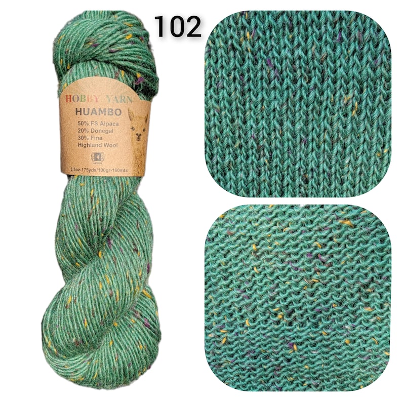 May include: A skein of green Hobby Yarn Huambo wool blend with flecks of yellow and purple. The label reads "50% FS Alpaca, 20% Donegal, 30% Fine Highland Wool". The number "102" is printed in white. Two close-up knit swatches are also shown.