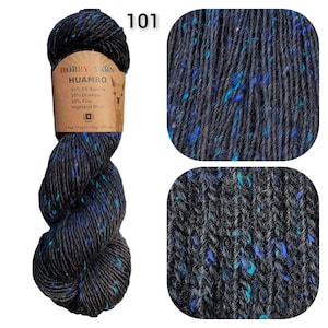May include: A skein of Hobby Yarn Huambo, color 101, featuring a dark gray base with flecks of blue and teal. The label indicates the yarn is a blend of alpaca, Donegal, and Highland wool. The skein weighs 3.5 oz and is 175 yards long.