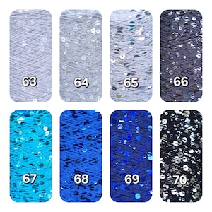 May include: Eight spools of yarn arranged in two rows, labeled 63 through 70. The yarn colors include light gray, silver, dark gray, bright blue, medium blue, navy blue, and black, all featuring reflective sequins integrated into the thread.