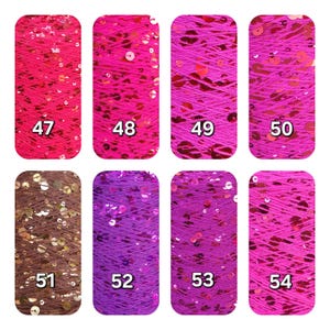 May include: Eight vertical spools of yarn arranged in two rows, labeled 47 through 54. The yarn features vibrant pink, purple, and brown hues, each intricately woven with reflective, circular sequins that catch the light across the textured surface.