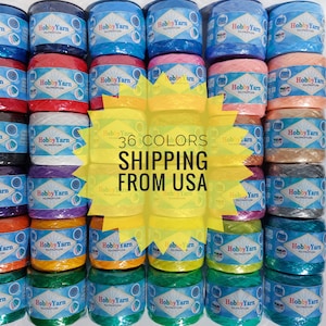 May include: A collection of 36 spools of colorful hobby yarn, each spool labeled "Hobby Yarn". The spools are arranged in rows and columns, with a yellow starburst graphic in the center that reads "36 COLORS SHIPPING FROM USA".