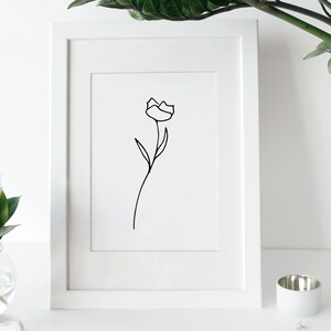 Simple line drawn of a rose in a picture frame.