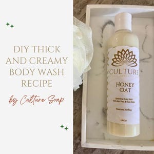May include: A bottle of Honey Oat body wash by Culture Soap sits on a white tray with a marble design. The label features a gold lotus flower design and the text "Honey Oat". The body wash is 9.8 fl oz.