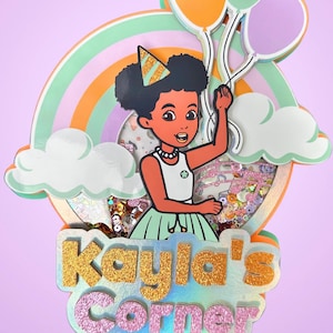 May include: A cake topper featuring a girl with brown hair and a party hat holding balloons. The balloons are orange, purple, and green. The topper also includes a rainbow and a cloud. The text "Kayla's Corner" is written in gold and pink letters.