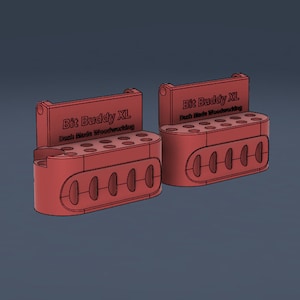 May include: Two red plastic bit holders with the text "Bit Buddy XL Dash Made Woodworking" on the front. Each holder has 12 holes for bits and 5 larger holes on the bottom.