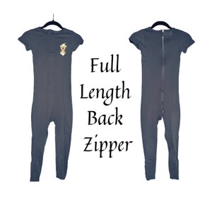 May include: A gray short-sleeved jumpsuit with a full-length back zipper. The jumpsuit has a small embroidered bear on the front.