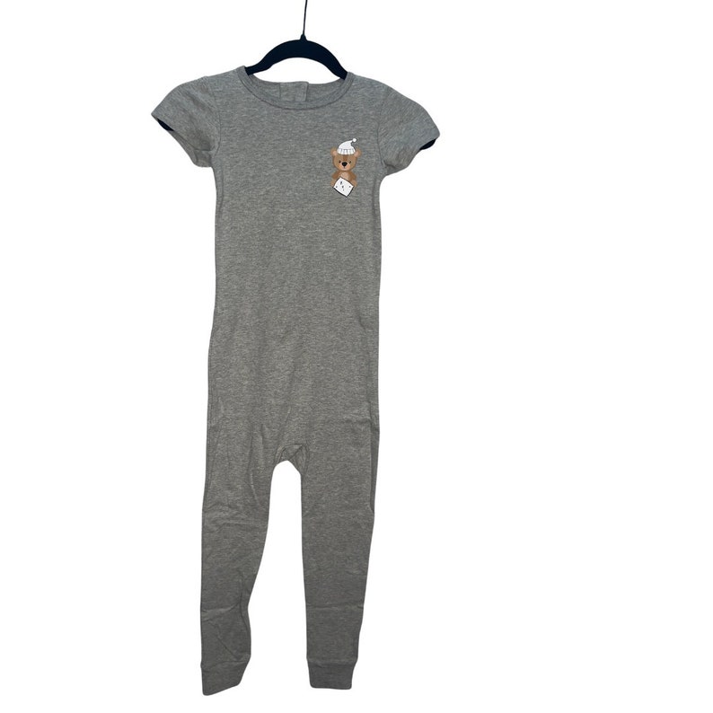 May include: Gray short-sleeved jumpsuit with a bear wearing a sleep cap on the front.