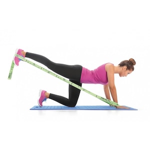May include: A woman demonstrates a leg exercise using a green resistance band on a blue yoga mat. The band is marked with numbers from 1 to 8.