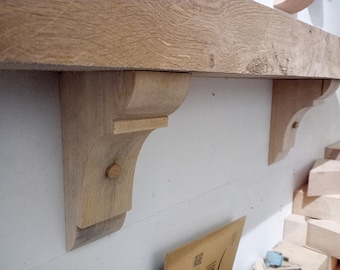 A pair of solid pine mantel corbels