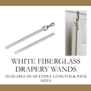 May include: Two white fiberglass drapery wands with silver clips. The wands are shown against a white background. The text "WHITE FIBERGLASS DRAPERY WANDS" is below the wands. The text "AVAILABLE IN MULTIPLE LENGTHS & PACK SIZES" is below the text "WHITE FIBERGLASS DRAPERY WANDS".