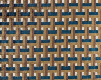 May include: A textile fabric featuring a repeating geometric pattern of interlocking horizontal and vertical bars in shades of deep teal, warm brown, and white. The surface has a soft, textured appearance with a consistent woven-style design.