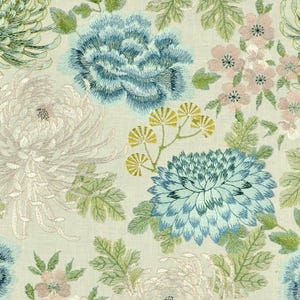 May include: A beige fabric with an embroidered floral pattern. The flowers are in shades of blue, green, and white. The pattern includes chrysanthemums, peonies, and leaves.
