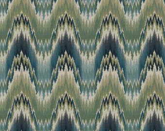 May include: A seamless pattern with a chevron design in shades of blue, green, and white. The pattern is reminiscent of an ikat or tribal design.