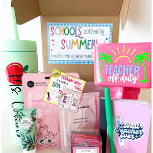 May include: A pink gift box filled with teacher appreciation gifts. The box includes a pink tumbler with the text "Teacher off duty", a pink notebook with the text "Best Teacher Ever", a pink face mask, a green hand cream, a pink spa gift set, and a pink card with the text "Thank you for being a spa teacher".